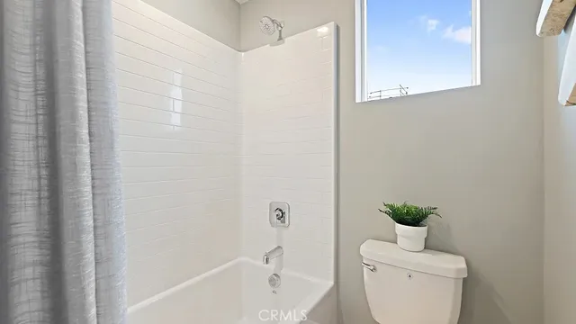 a en suite bathroom with a sink and a mirror
