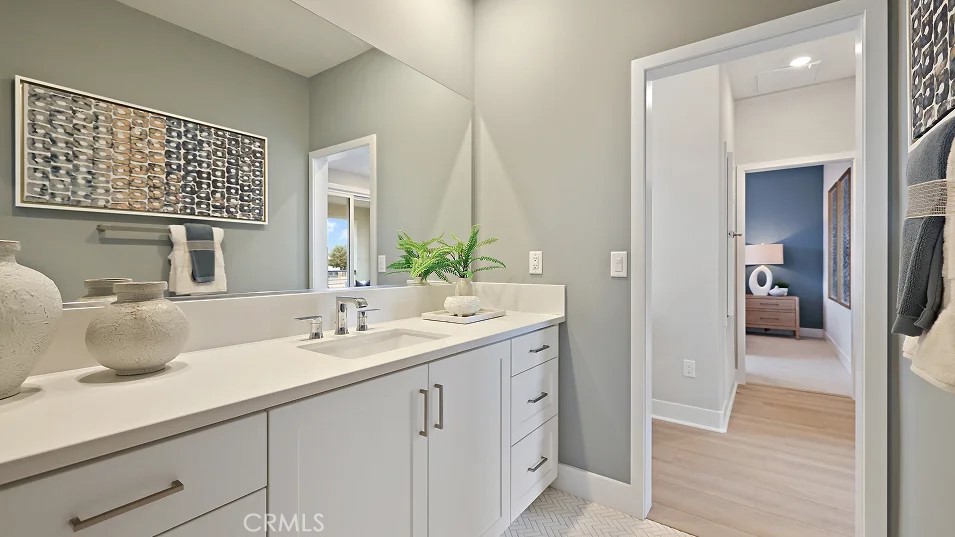 1711 Lychee Street Fullerton, CA 92833 - Photo 21 of 29 a en suite bathroom with a sink and a mirror