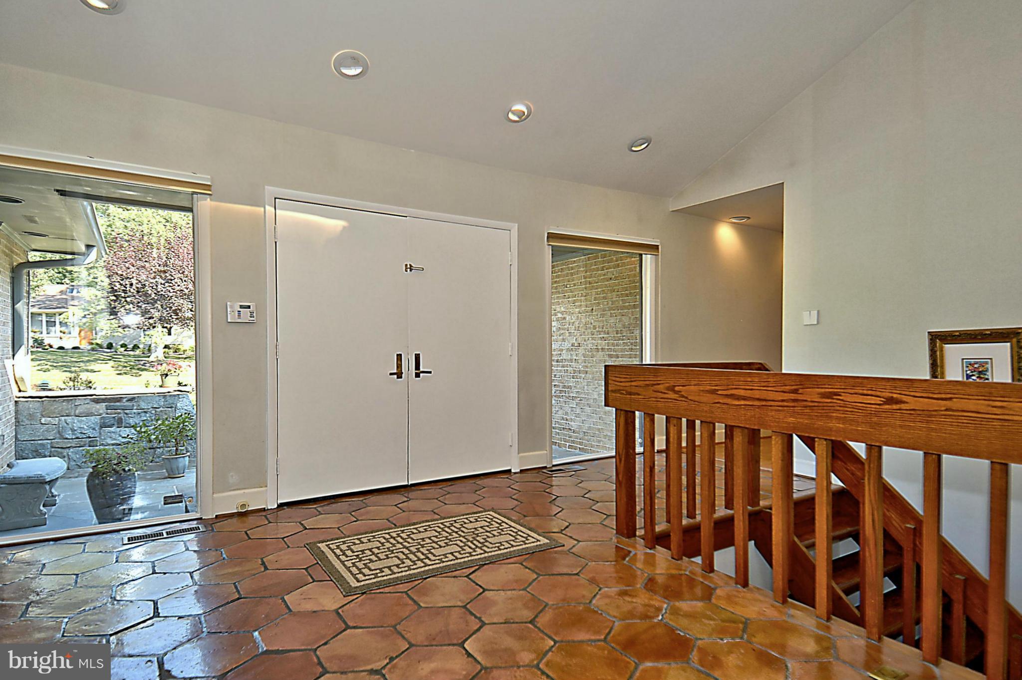 Foyer has skylight & hand made Floor Tiles