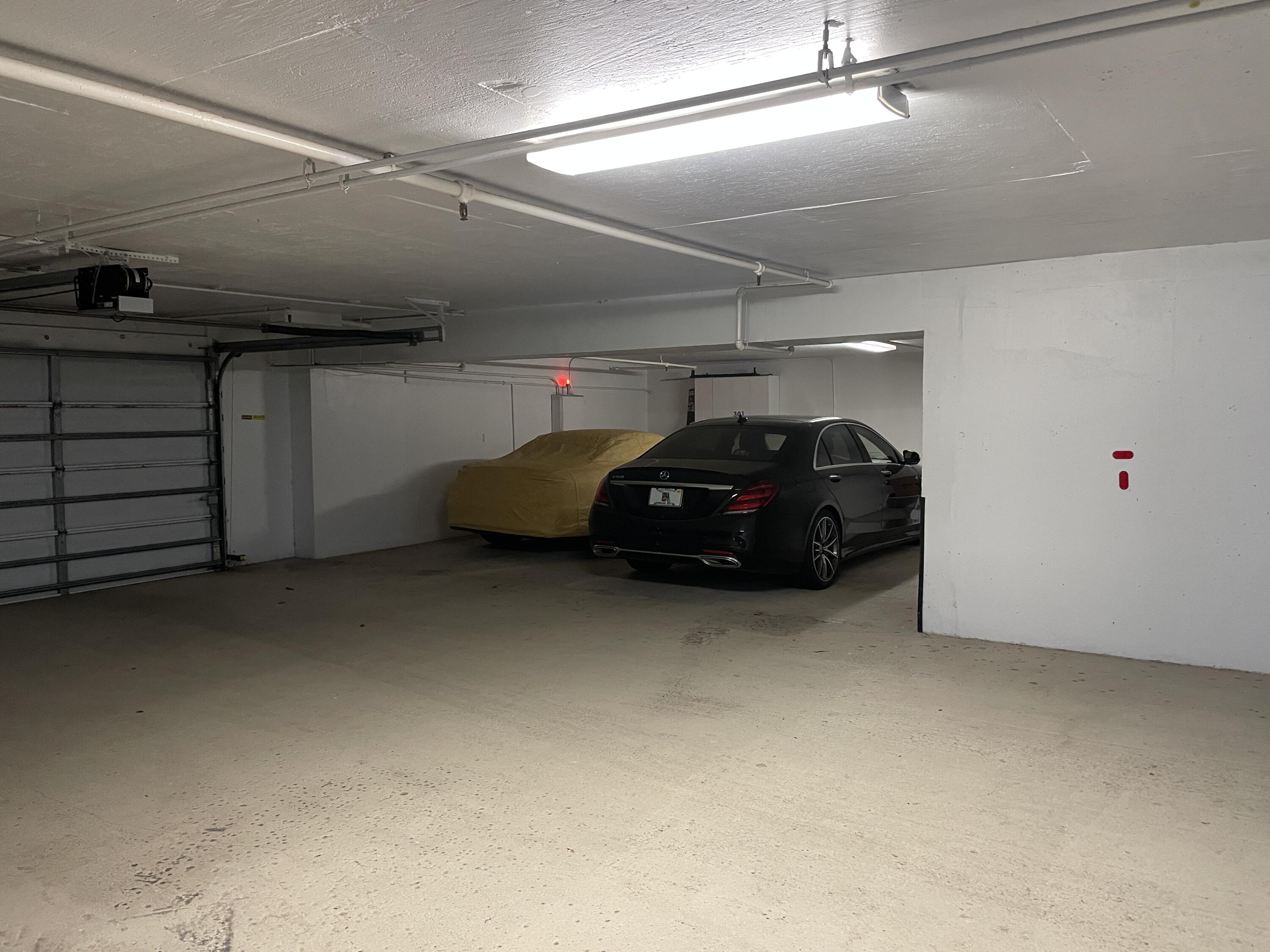 145 Peruvian Avenue, Unit 301 Palm Beach, FL 33480 - Photo 16 of 16 a car parked in a garage