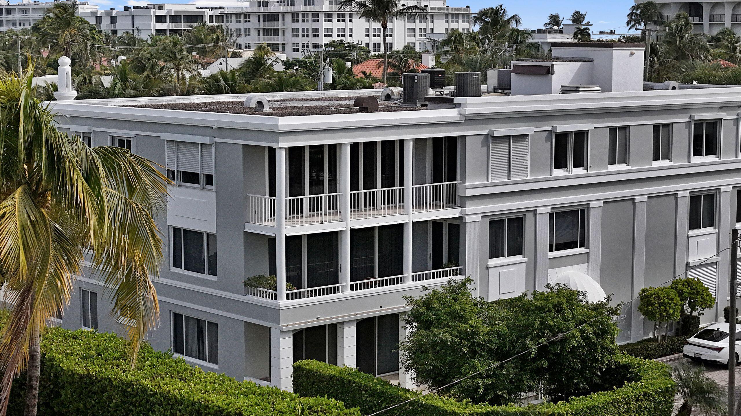 145 Peruvian Avenue, Unit 301 Palm Beach, FL 33480 - Photo 8 of 16 a view of building with large windows and plants