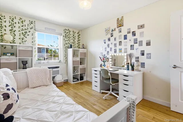 a bedroom with a bed and cabinets