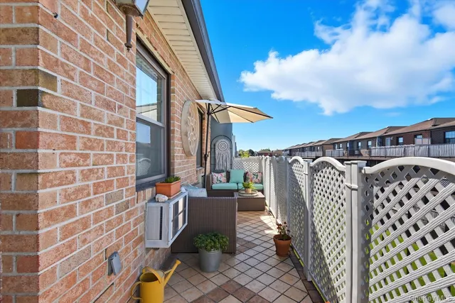 a view of a patio with table and chairs