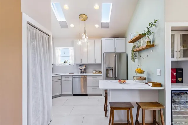 a kitchen with a sink cabinets and stainless steel appliances