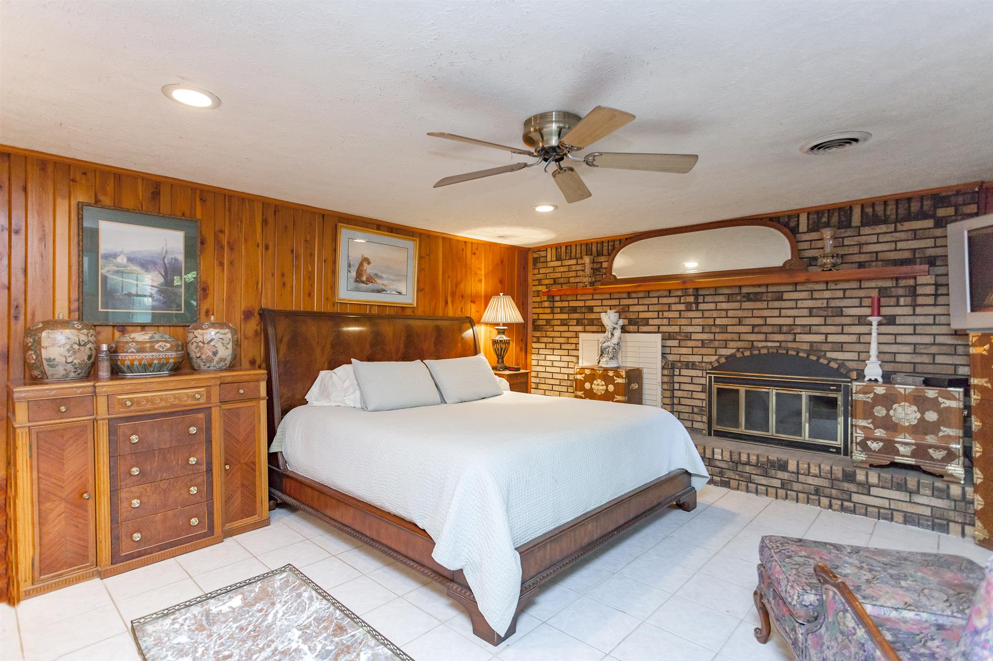 1635 Camp Ravine Road Burns, TN 37029 - Photo 18 of 28 a bed room with a bed and a fireplace