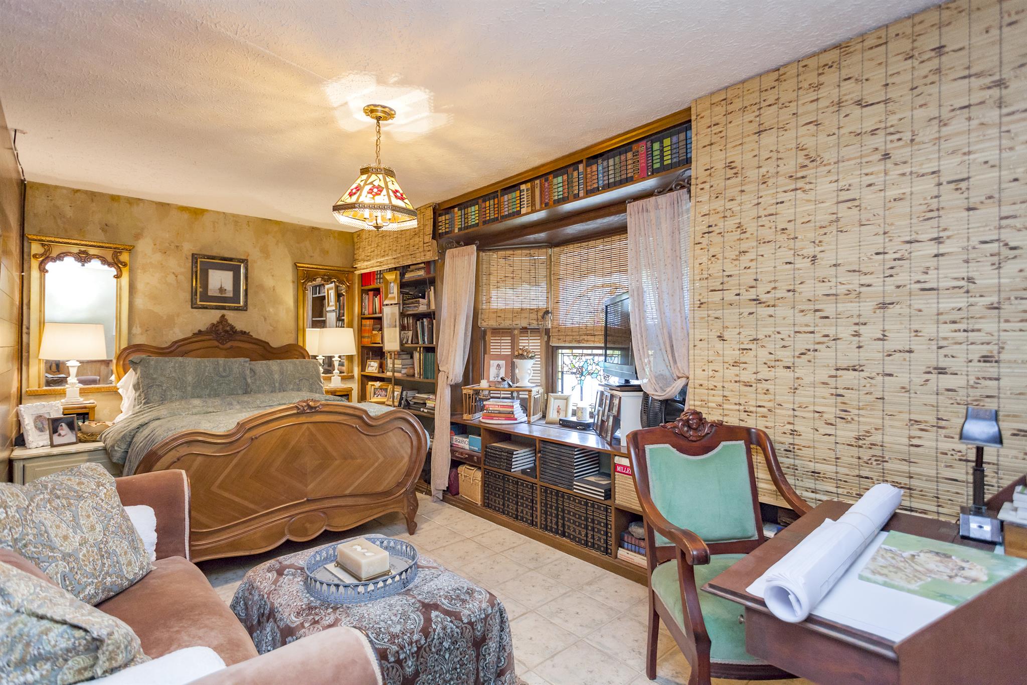 1635 Camp Ravine Road Burns, TN 37029 - Photo 23 of 28 a bedroom with furniture and a chandelier