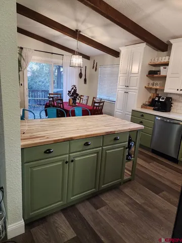 a kitchen with stainless steel appliances a sink stove and refrigerator