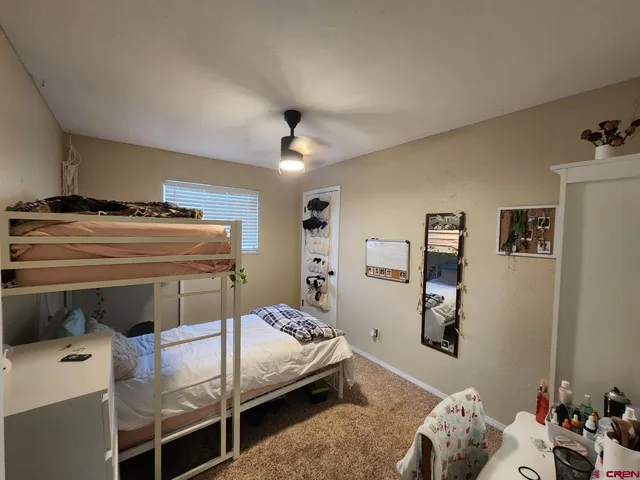 a bedroom with a bed and furniture