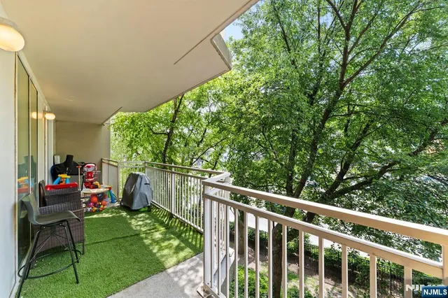 a view of a chair and tables in the backyard