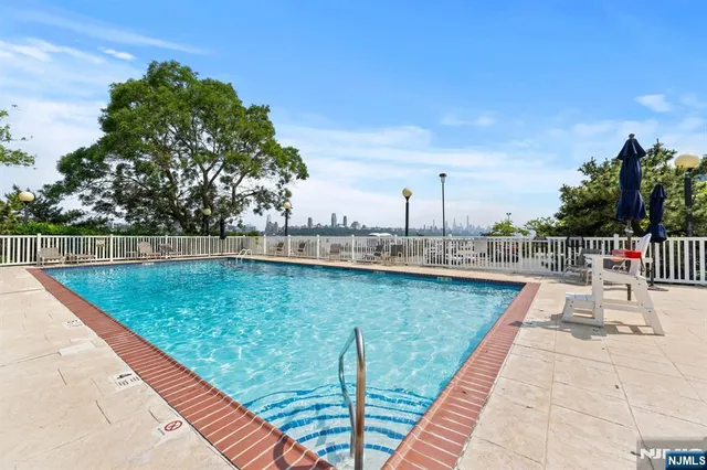 a view of a swimming pool with a patio