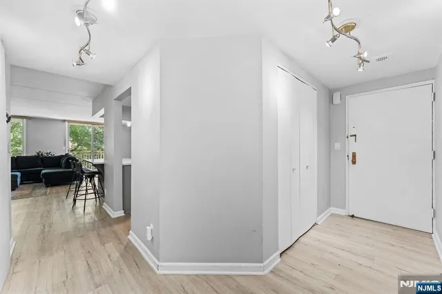 a view of a livingroom with furniture and hardwood floor