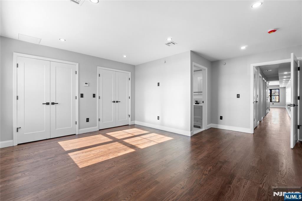 481 15th Avenue Newark, NJ 07103 - Photo 17 of 19 a view of an empty room with wooden floor