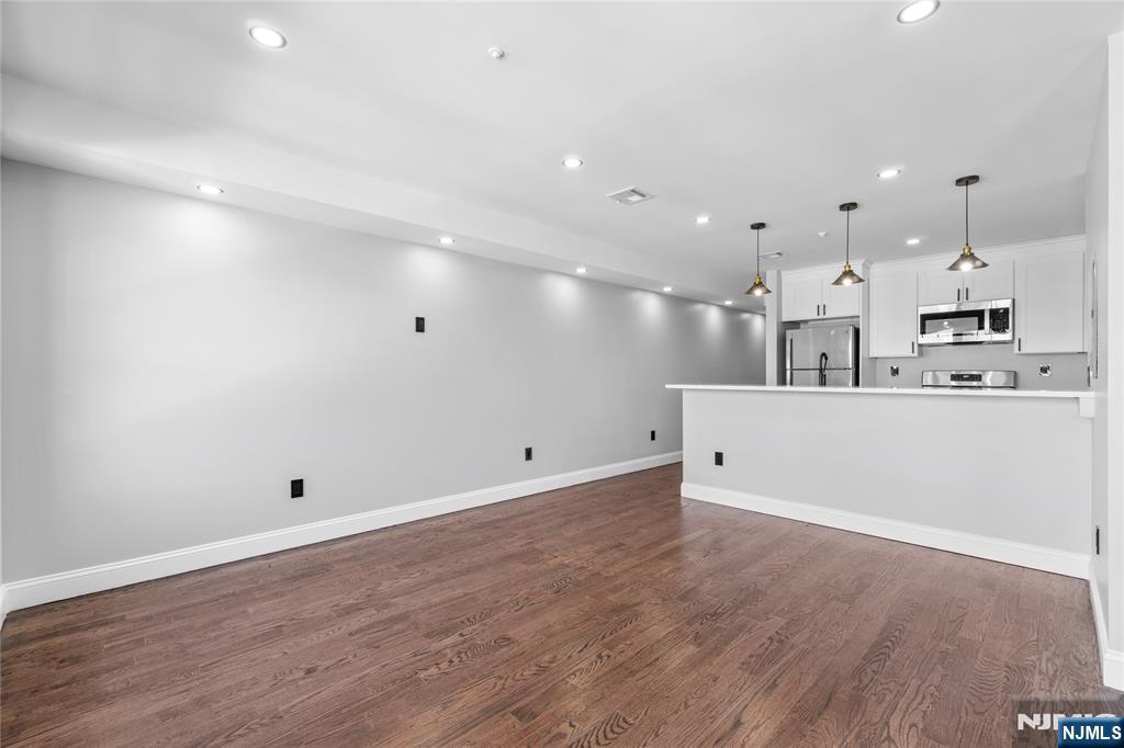 481 15th Avenue Newark, NJ 07103 - Photo 3 of 19 a view of kitchen with kitchen island and stainless steel appliances