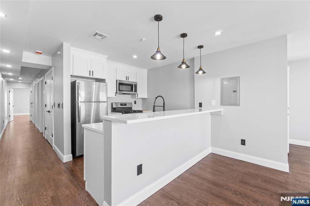 481 15th Avenue Newark, NJ 07103 - Photo 4 of 19 a view of a kitchen with electric appliances