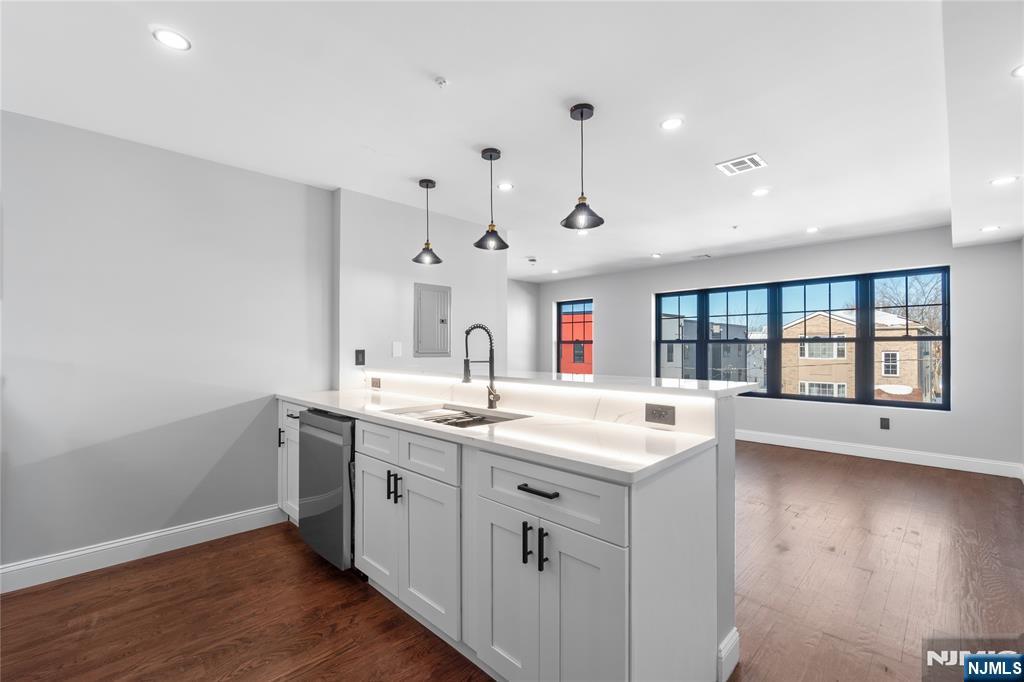 481 15th Avenue Newark, NJ 07103 - Photo 6 of 19 a view of a kitchen sink and wooden floor