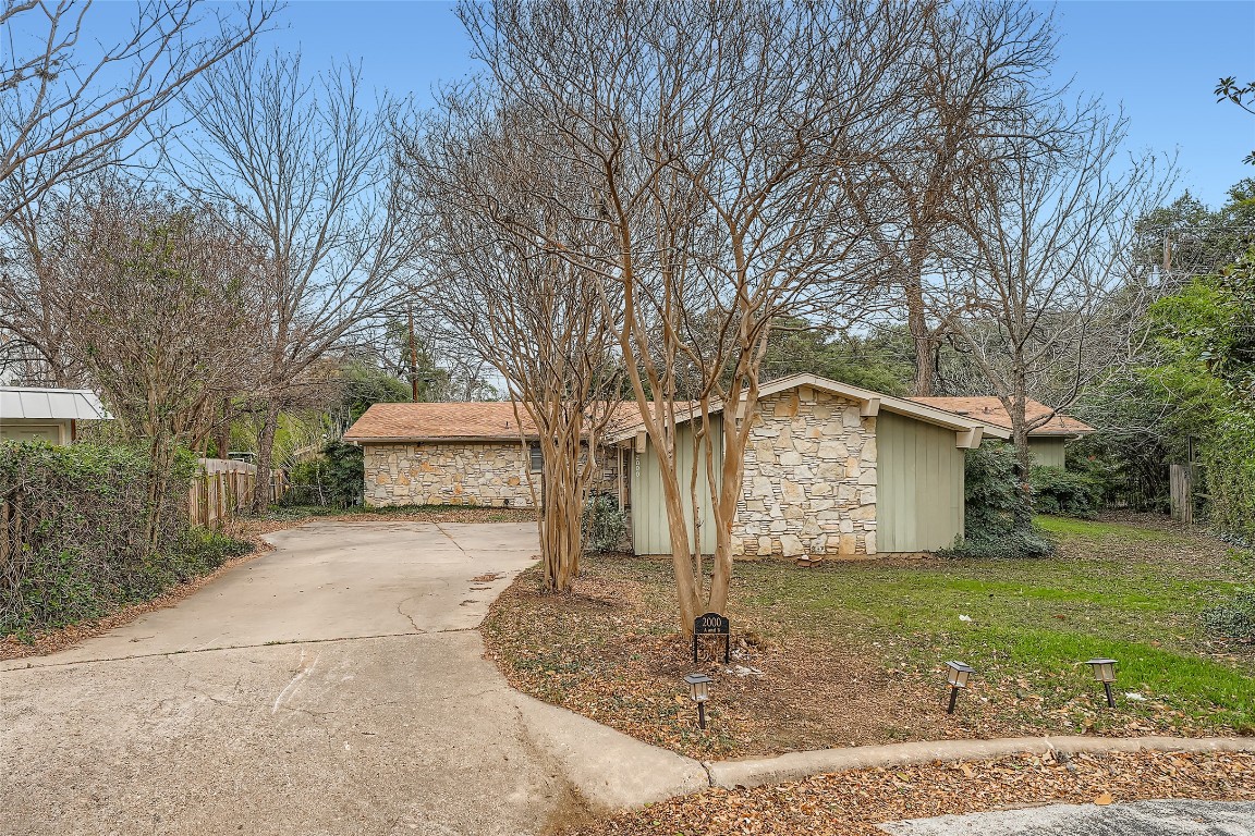 2000 Cody Court, Unit A Austin, TX 78704 - Photo 2 of 36 a front view of a house with a yard and garage