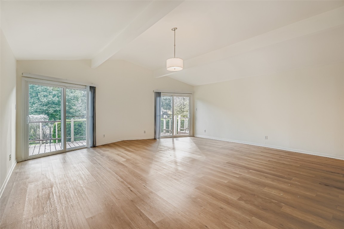 2000 Cody Court, Unit A Austin, TX 78704 - Photo 4 of 36 an empty room with wooden floor and windows