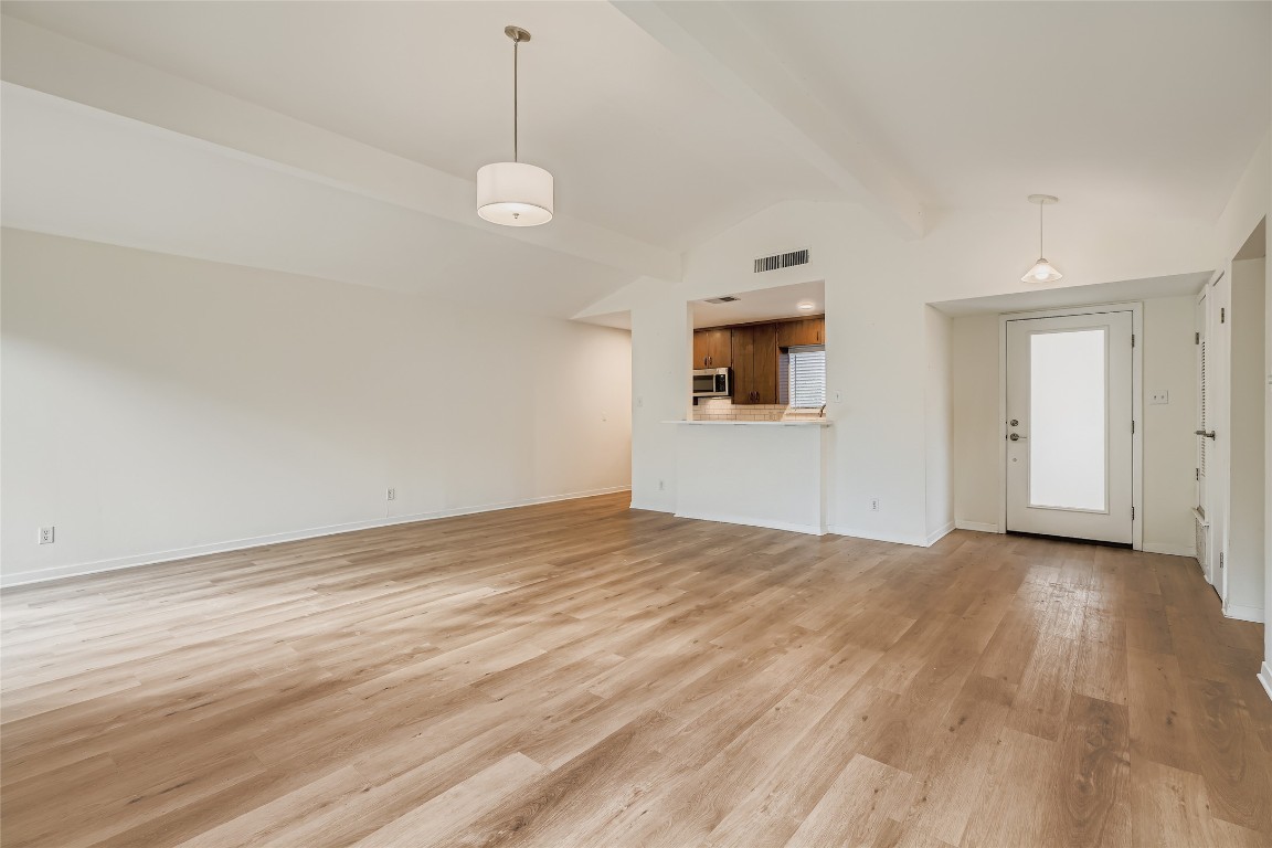 2000 Cody Court, Unit A Austin, TX 78704 - Photo 5 of 36 a view of empty room with wooden floor and ceiling fan