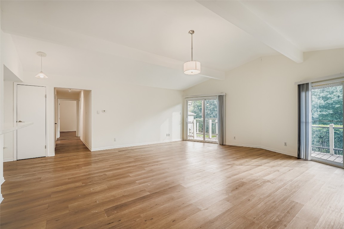 2000 Cody Court, Unit A Austin, TX 78704 - Photo 7 of 36 a view of an empty room with window and wooden floor