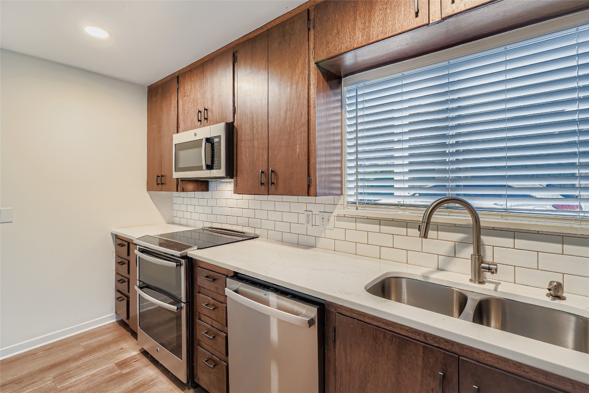 2000 Cody Court, Unit A Austin, TX 78704 - Photo 10 of 36 a view of a kitchen counter space a sink and wooden floor