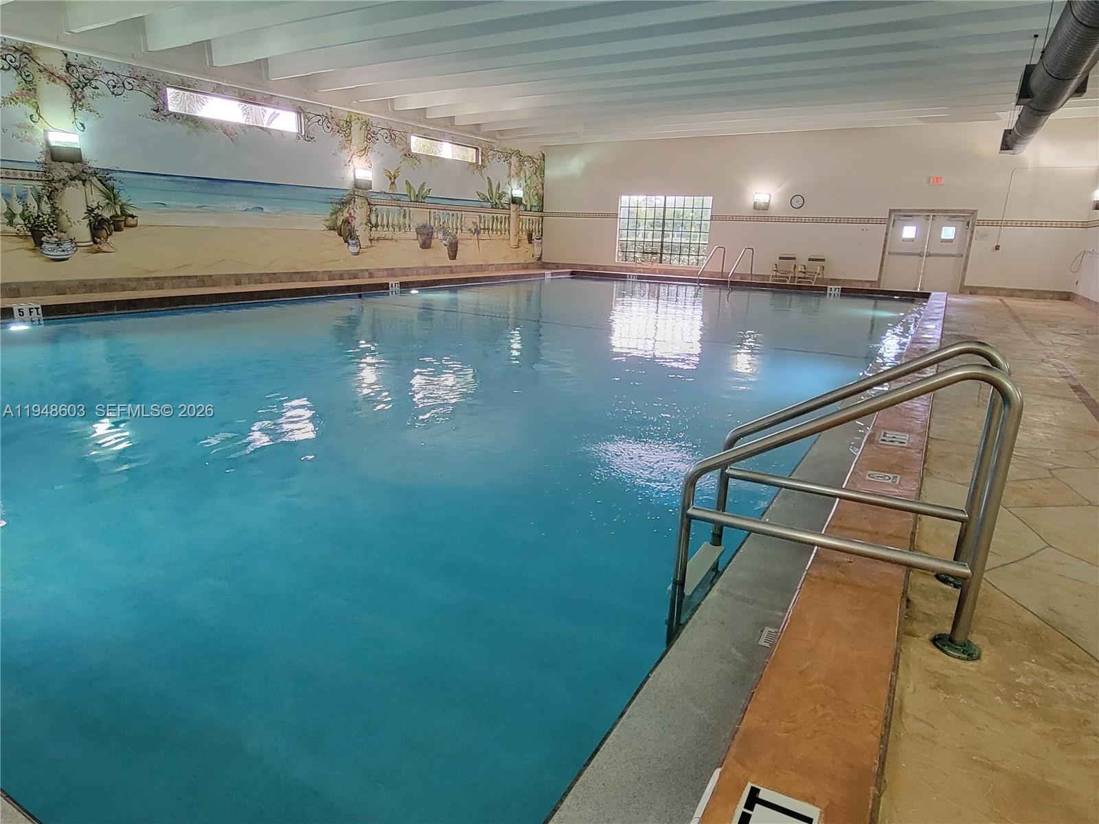 196 Mansfield F, Unit 196 Boca Raton, FL 33434 - Photo 47 of 58 a view of a swimming pool