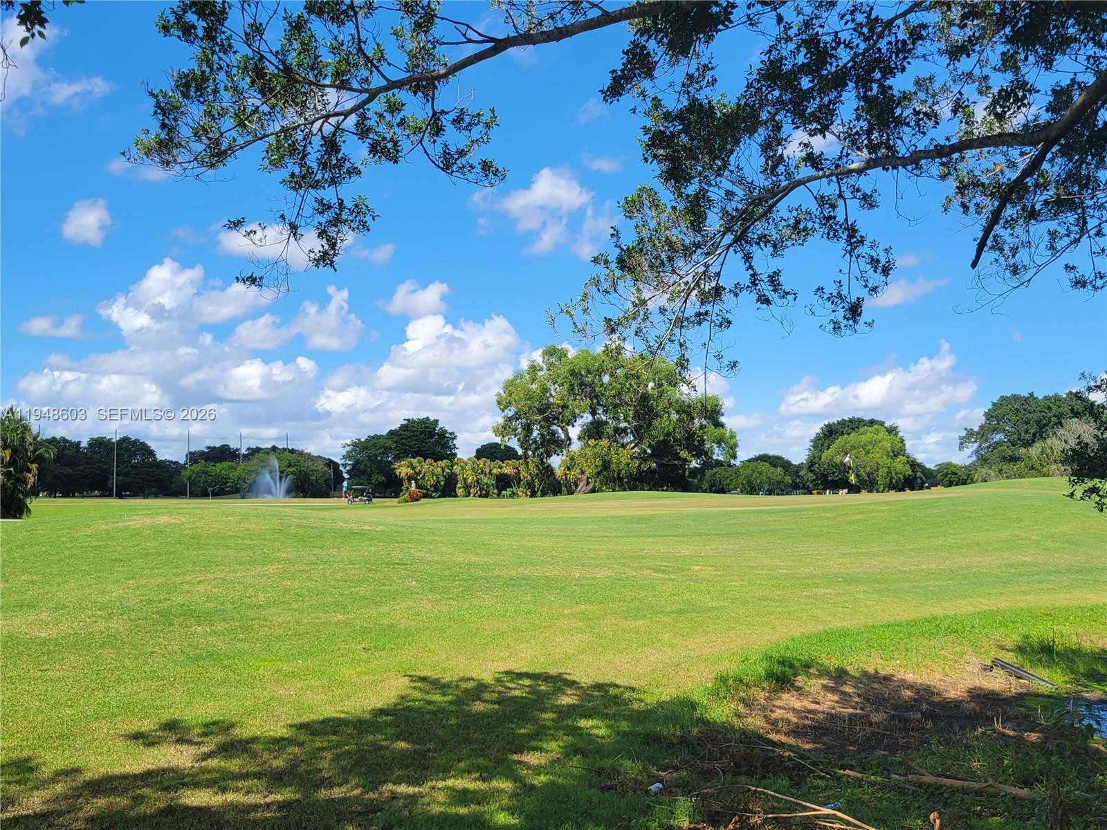 196 Mansfield F, Unit 196 Boca Raton, FL 33434 - Photo 53 of 58 a view of a big yard with lots of green space