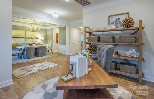 a bedroom with furniture and a wooden floor