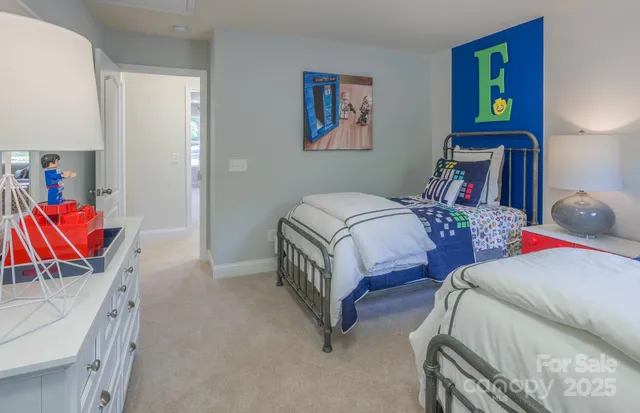 a bedroom with two beds and a couch