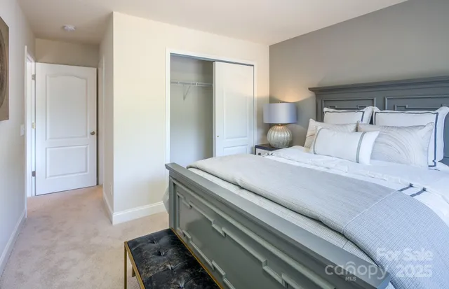a bedroom with a bed and a cabinets