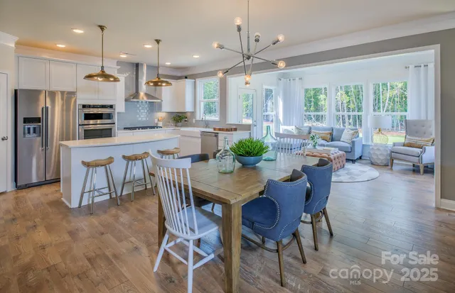 a view of a dining room with furniture window and outside view