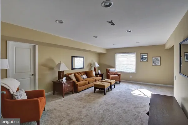 a view of a livingroom with furniture and window