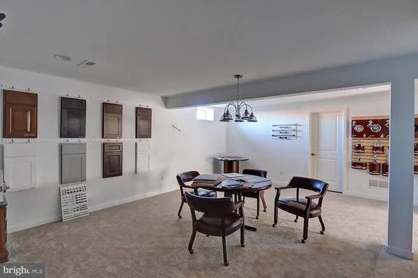 a bathroom with a sink mirror and vanity