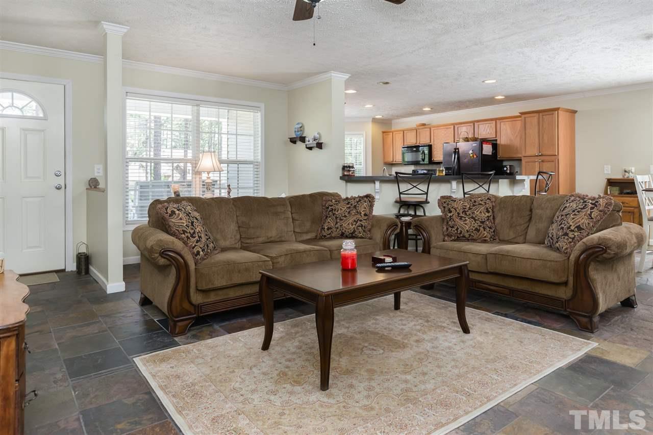 707 Sun Road Aberdeen, NC 28315 - Photo 2 of 23 a living room with furniture and a large window