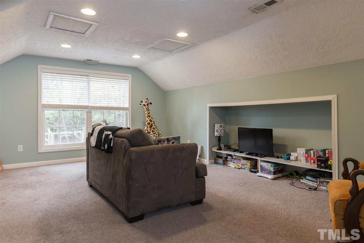 707 Sun Road Aberdeen, NC 28315 - Photo 16 of 23 a living room with furniture and a flat screen tv