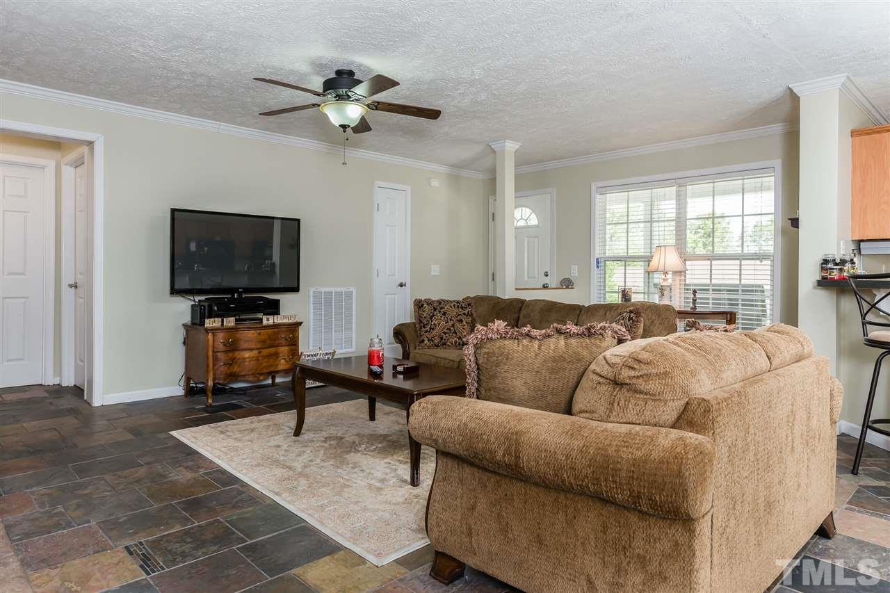 707 Sun Road Aberdeen, NC 28315 - Photo 3 of 23 a living room with furniture and a flat screen tv