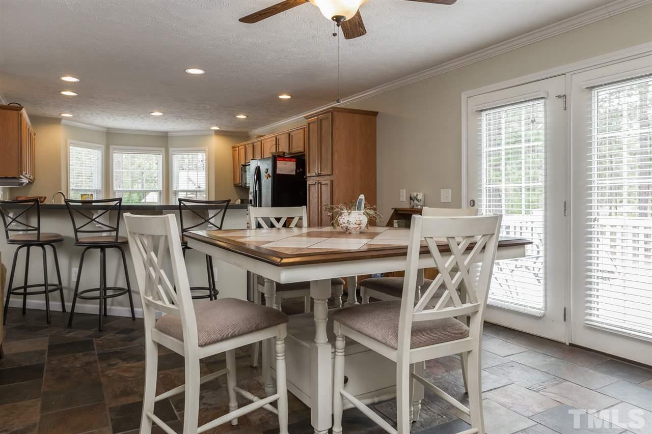 707 Sun Road Aberdeen, NC 28315 - Photo 9 of 23 a view of a dining room with furniture