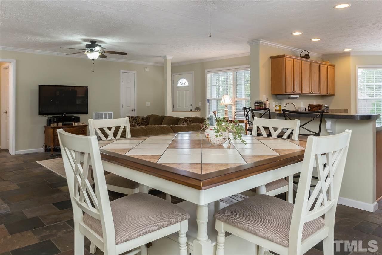 707 Sun Road Aberdeen, NC 28315 - Photo 10 of 23 a view of a dining room with furniture