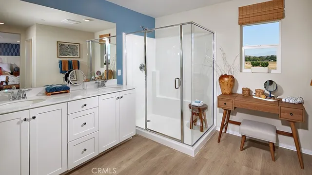 a bed room with a bed and a potted plant