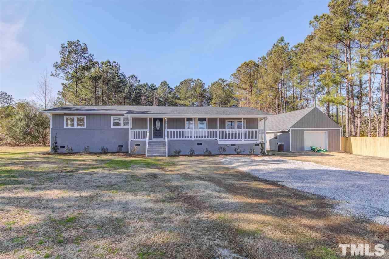 3317 Broughton Road Wendell, NC 27591 - Photo 1 of 11 a front view of a house with a yard and garage