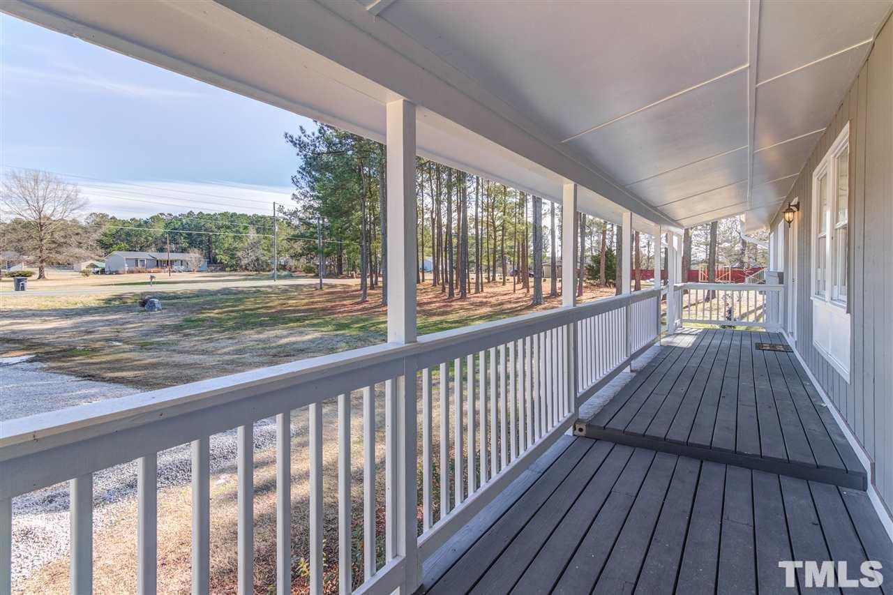 3317 Broughton Road Wendell, NC 27591 - Photo 2 of 11 a view of a balcony with wooden floor