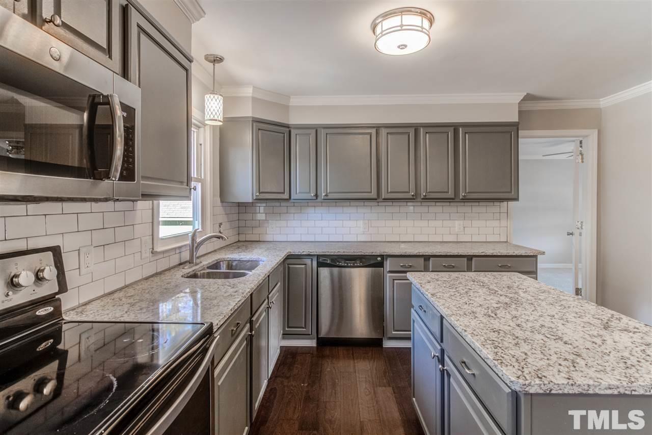 3317 Broughton Road Wendell, NC 27591 - Photo 5 of 11 a kitchen with a sink stove and microwave