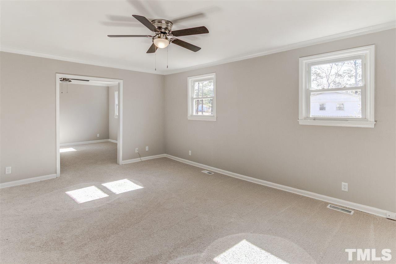 3317 Broughton Road Wendell, NC 27591 - Photo 7 of 11 a view of an empty room with a window