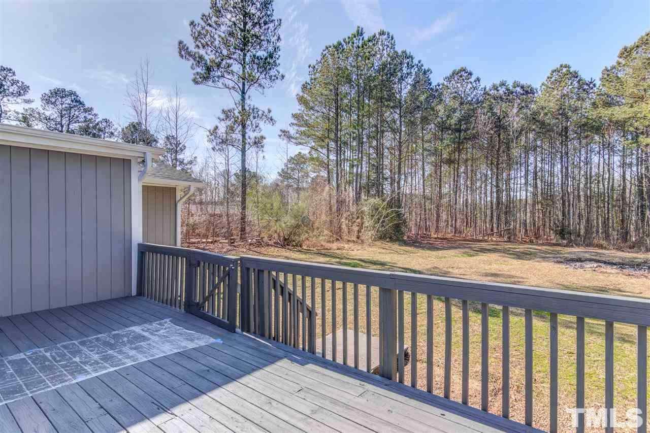 3317 Broughton Road Wendell, NC 27591 - Photo 10 of 11 a view of balcony with wooden floor and fence