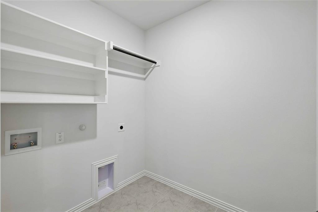 949 Schuberts Road Justin, TX 76247 - Photo 22 of 24 Laundry area with gas dryer hookup, electric dryer hookup, and hookup for a washing machine