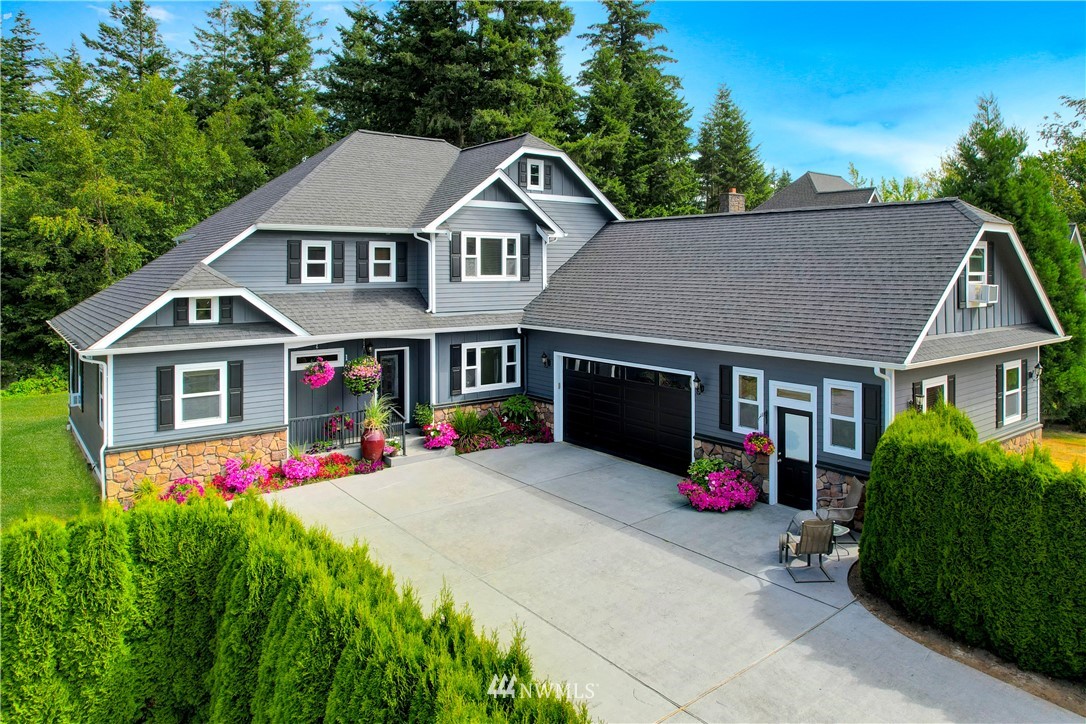 1290 West Axton Road Ferndale, WA 98248 - Photo 1 of 36 a front view of a house with yard