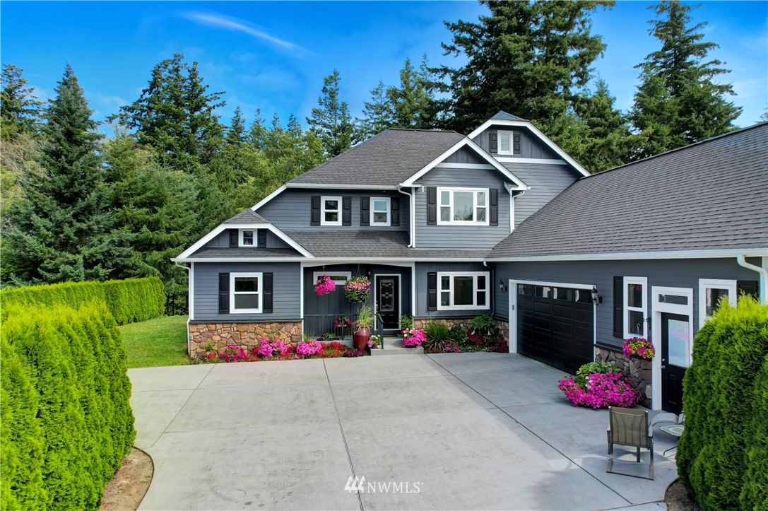 1290 West Axton Road Ferndale, WA 98248 - Photo 2 of 36 a front view of a house with yard