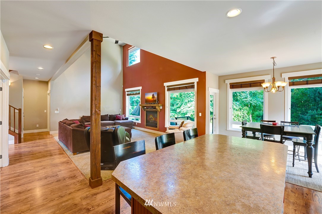 1290 West Axton Road Ferndale, WA 98248 - Photo 15 of 36 a living room with furniture a large window wooden floor and a rug