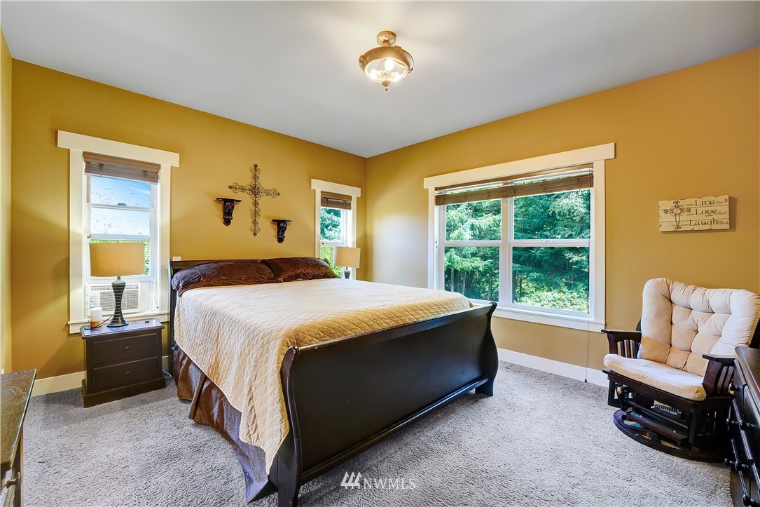 1290 West Axton Road Ferndale, WA 98248 - Photo 16 of 36 a bedroom with a bed and a window