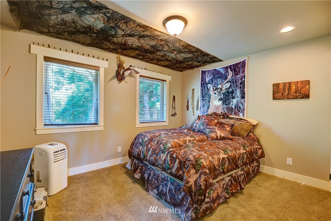 1290 West Axton Road Ferndale, WA 98248 - Photo 25 of 36 a bedroom with a bed and a window
