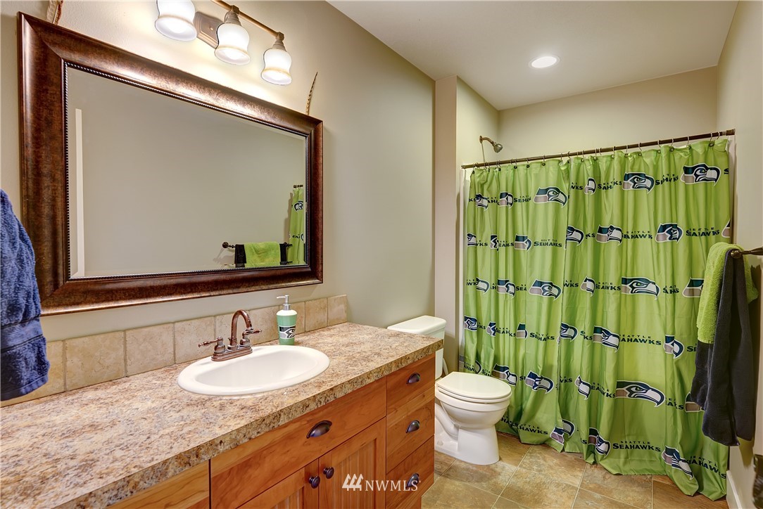 1290 West Axton Road Ferndale, WA 98248 - Photo 26 of 36 a bathroom with a granite countertop sink toilet and shower